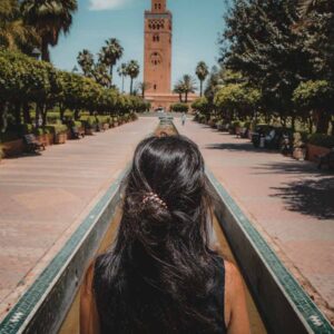 A woman walking toward the Koutoubia Mosque at the start of the Medina guided tour in Marrakech.