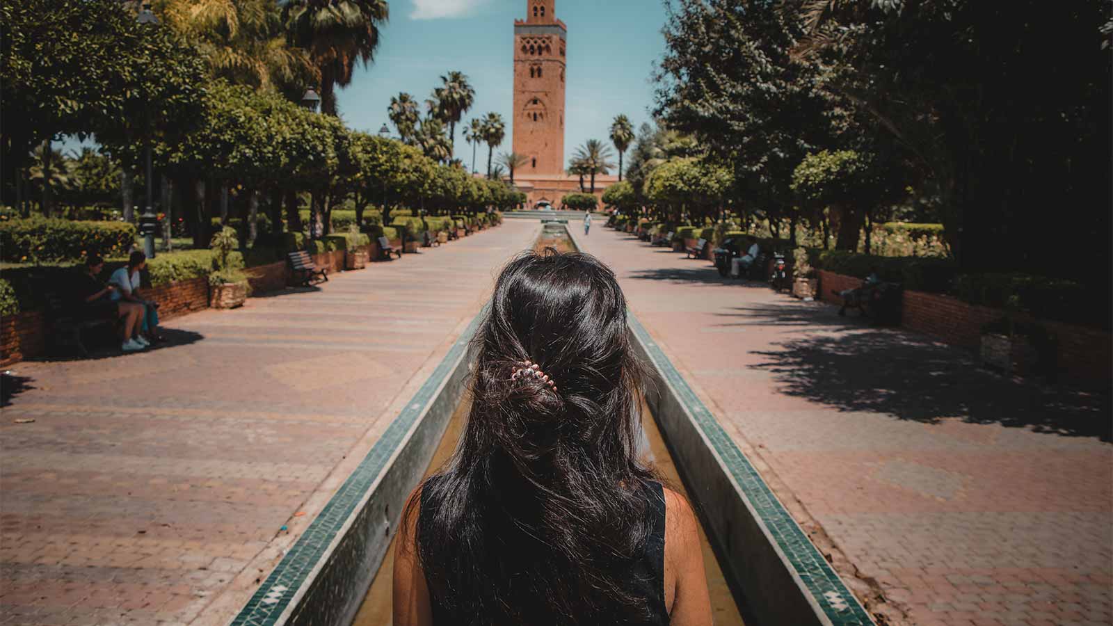 A woman walking toward the Koutoubia Mosque at the start of the Medina guided tour in Marrakech.