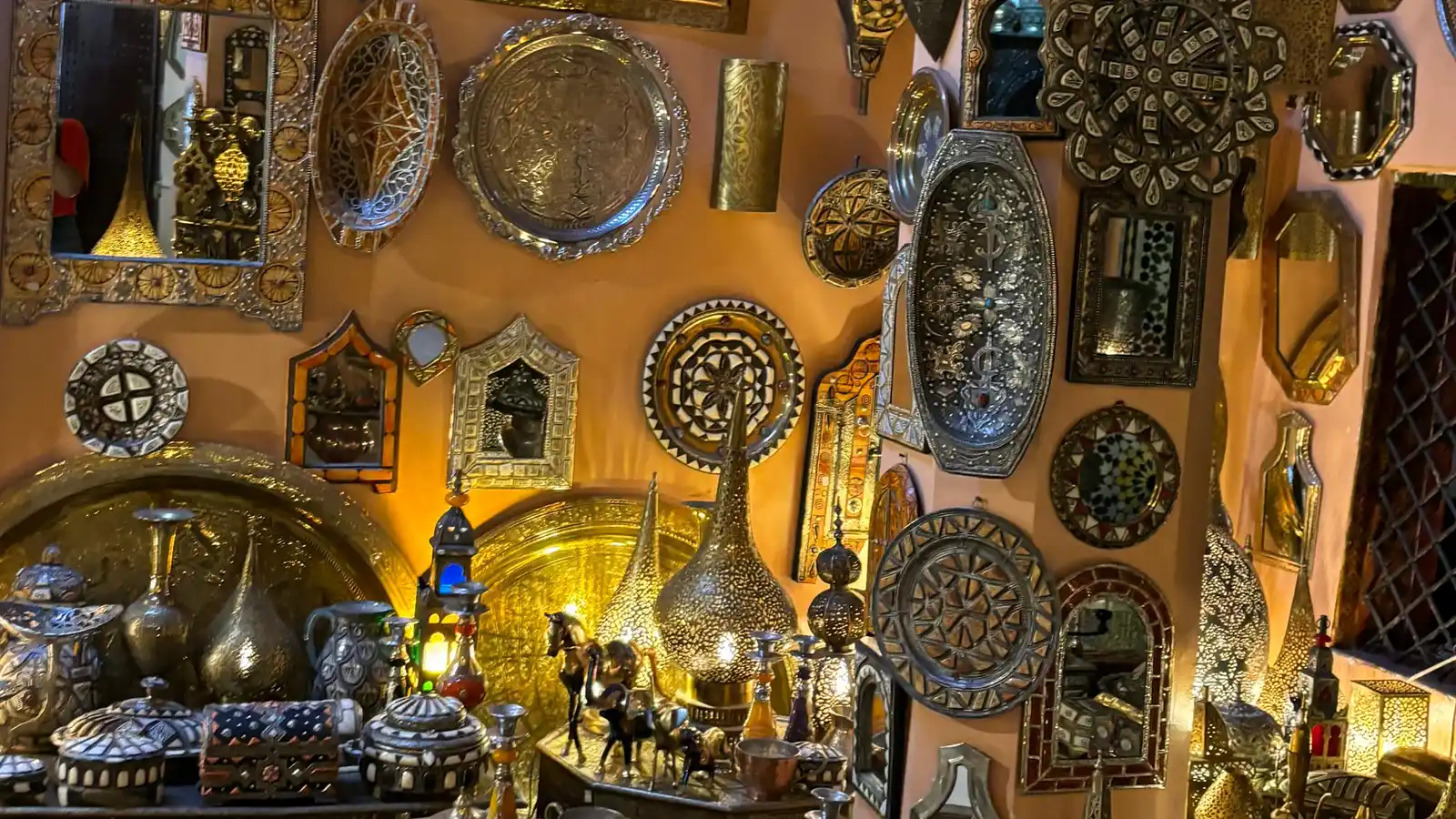 Fes souks shopping tour with hanging Moroccan crafts, lanterns and old medina artisan displays