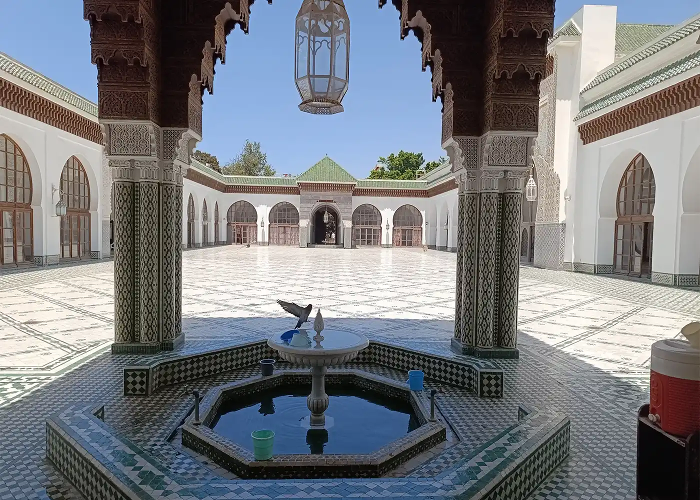 Traditional Moroccan courtyard with arches and zellige tiles in Rabat